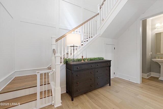 staircase with wood finished floors