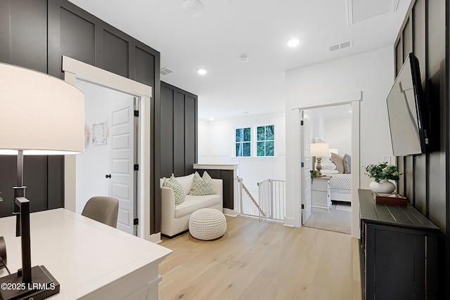 office with recessed lighting, baseboards, light wood-type flooring, and visible vents