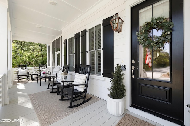 doorway to property featuring a porch