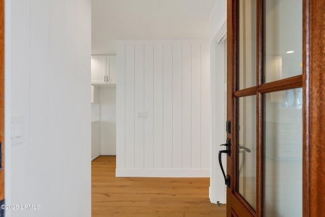 corridor featuring light hardwood / wood-style floors