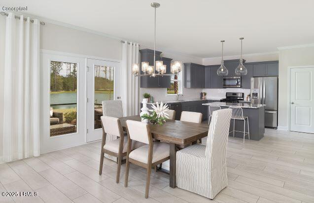 1118 Salty Hammock Ct, Beaufort, SC 29902 - dining space featuring crown molding, a chandelier, and light wood-type flooring