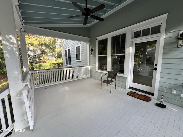 view of patio with ceiling fan and a porch