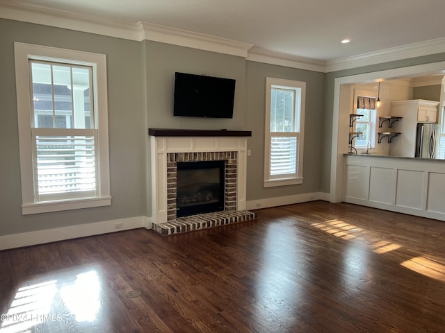 unfurnished living room with dark hardwood / wood-style flooring, crown molding, and a fireplace