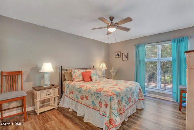 bedroom featuring hardwood / wood-style flooring and ceiling fan