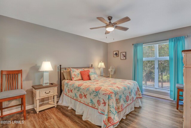 bedroom featuring hardwood / wood-style flooring and ceiling fan