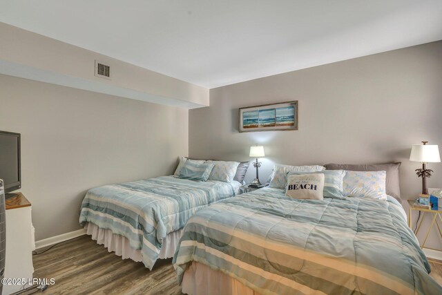 bedroom featuring dark wood-type flooring