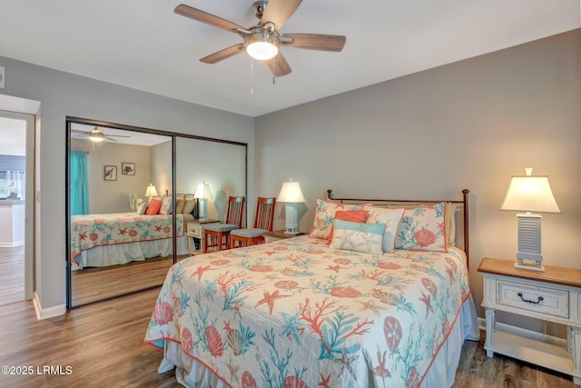 bedroom with ceiling fan, hardwood / wood-style floors, and a closet