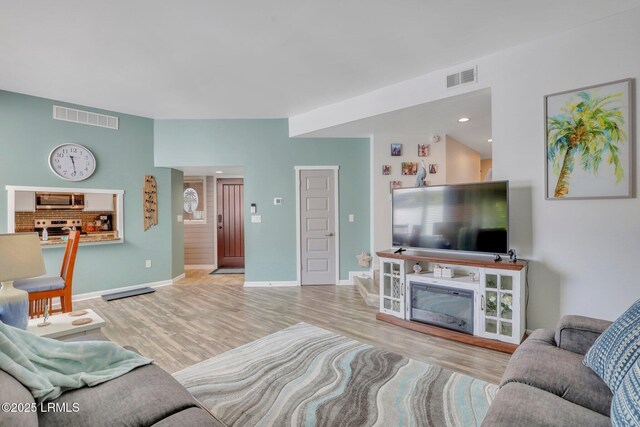 living room with light hardwood / wood-style floors