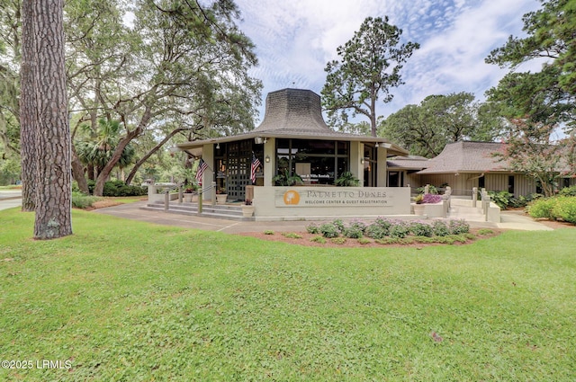 rear view of house with a lawn