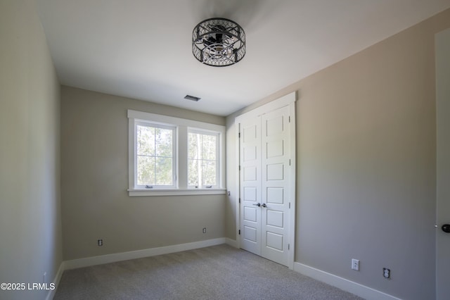 unfurnished bedroom with carpet floors