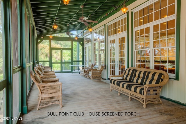 sunroom / solarium with ceiling fan