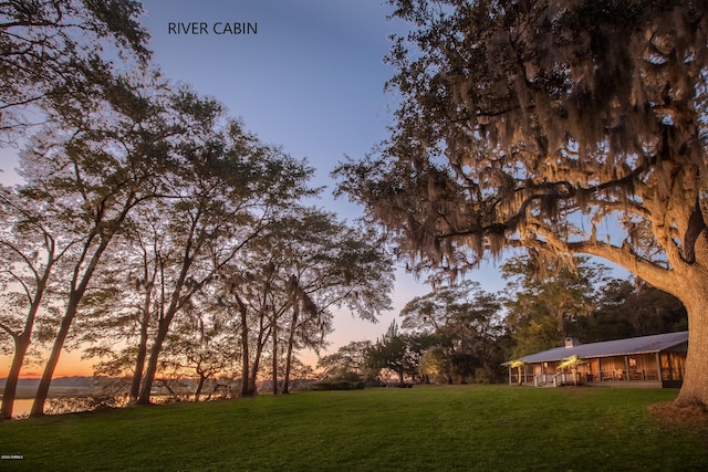 view of home's community featuring a lawn