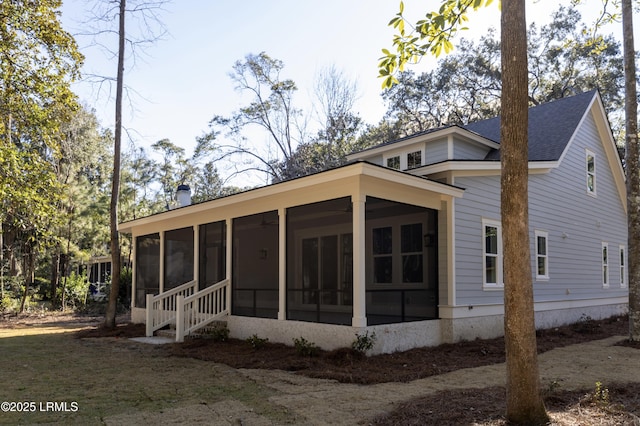 view of front of home with a sunroom