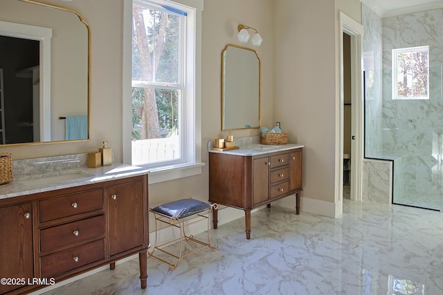 bathroom featuring vanity, a healthy amount of sunlight, and toilet