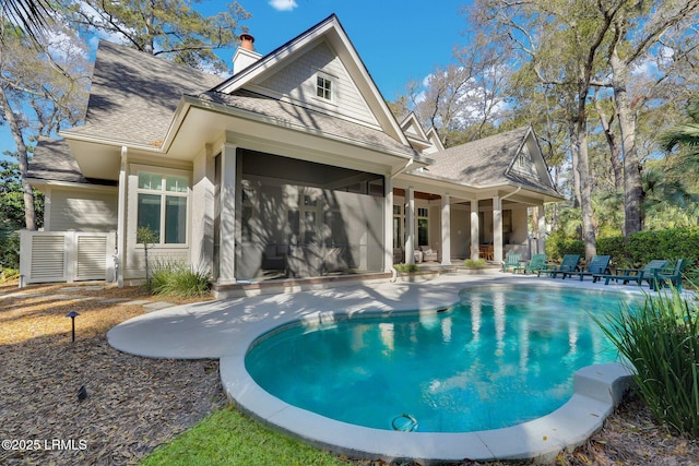 18 Baynard Cove Rd, Hilton Head Island, SC 29928 - view of pool featuring a patio area, a fenced in pool, and a sunroom