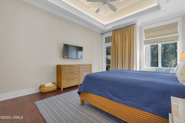 18 Baynard Cove Rd, Hilton Head Island, SC 29928 - bedroom with a raised ceiling, ornamental molding, a ceiling fan, wood finished floors, and baseboards