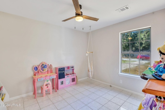 recreation room featuring ceiling fan and light tile patterned flooring