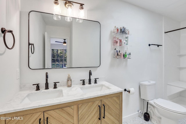 bathroom featuring ceiling fan, vanity, and toilet