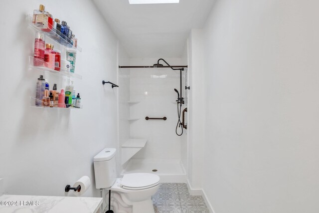 bathroom with a skylight, a shower, and toilet