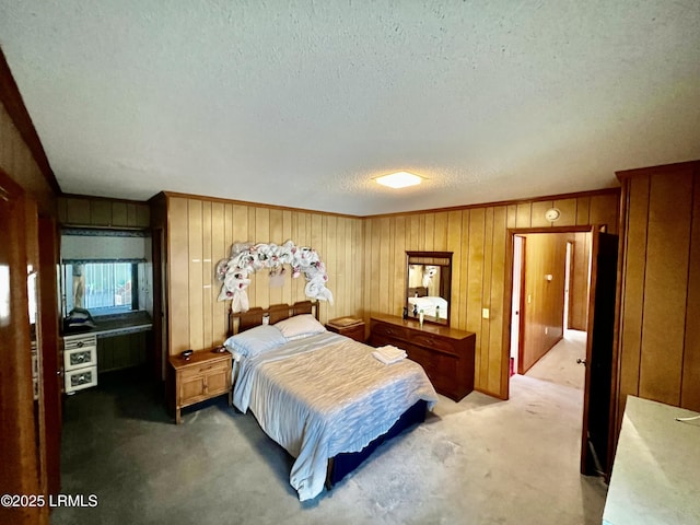 carpeted bedroom featuring a textured ceiling