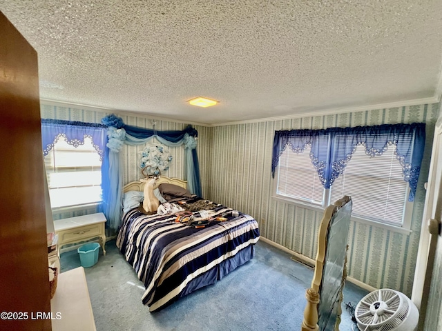 carpeted bedroom featuring a textured ceiling