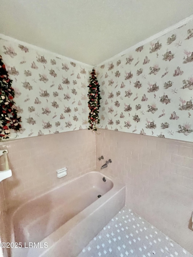 bathroom featuring tile walls and a tub