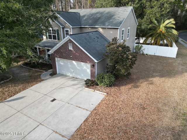 view of side of home with a garage