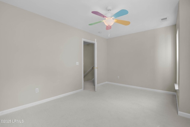 unfurnished bedroom with ceiling fan and light colored carpet