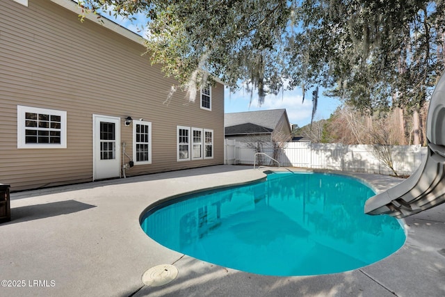 view of swimming pool featuring a patio and a water slide