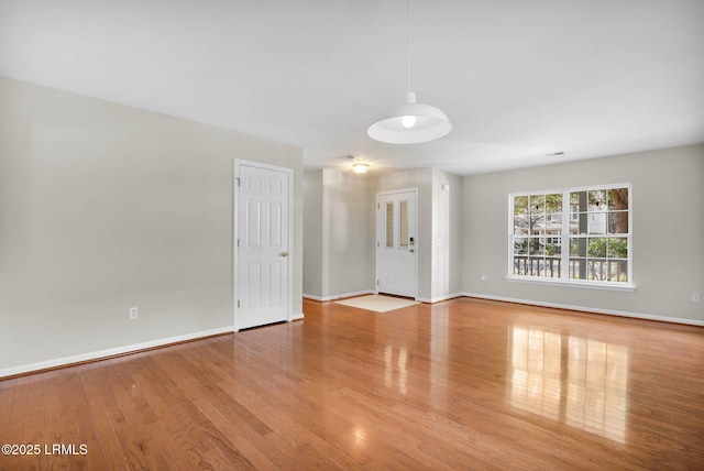 unfurnished room featuring light hardwood / wood-style flooring