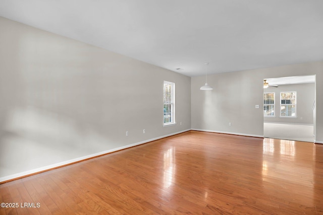 spare room featuring ceiling fan and light hardwood / wood-style floors