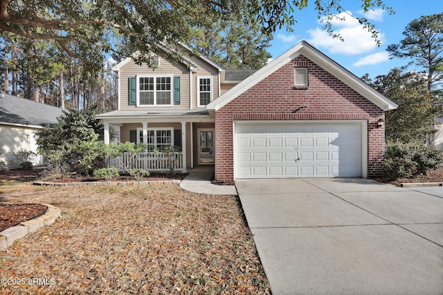 view of property with a porch and a garage