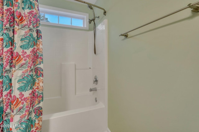 bathroom featuring shower / tub combo with curtain