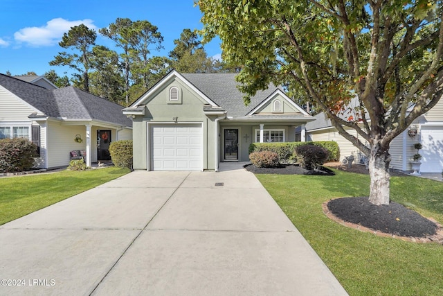 view of front of home featuring a garage and a front yard