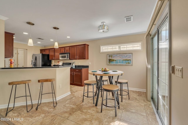 kitchen featuring decorative light fixtures, crown molding, plenty of natural light, and stainless steel appliances