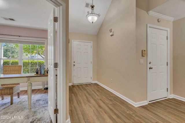 entryway featuring vaulted ceiling and light hardwood / wood-style floors