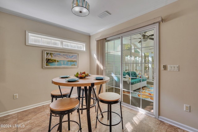 dining area with crown molding