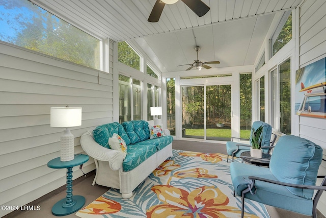 sunroom featuring lofted ceiling and ceiling fan