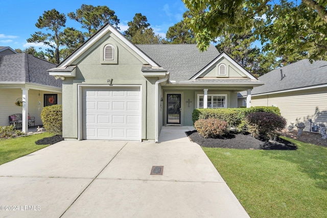 ranch-style home with a garage and a front yard