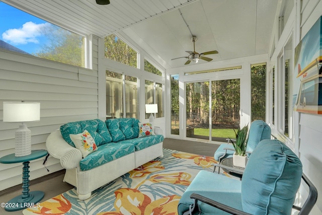 sunroom with lofted ceiling, a wealth of natural light, and ceiling fan