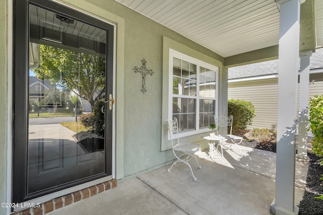 property entrance featuring covered porch