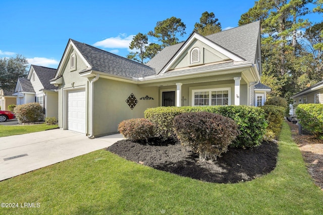 view of front facade with a garage and a front yard