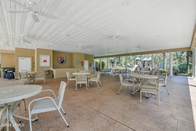 view of patio / terrace featuring ceiling fan and a playground