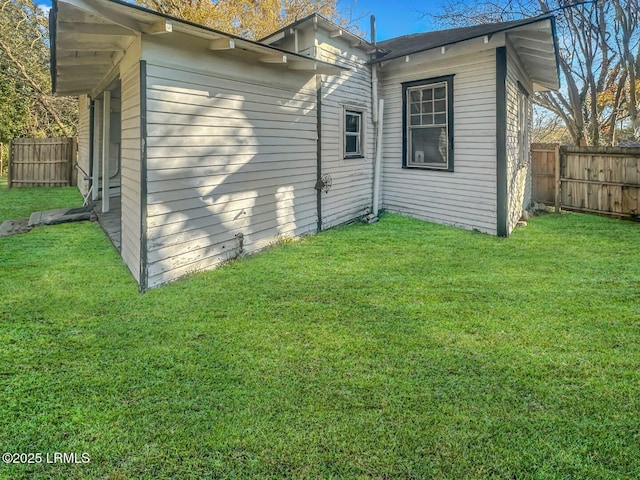 view of home's exterior featuring a yard