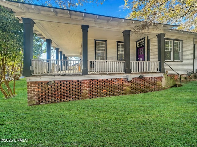 exterior space featuring a porch and a lawn