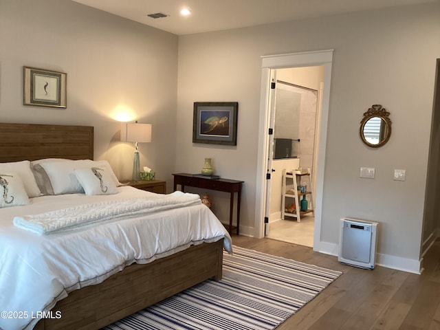 bedroom featuring hardwood / wood-style floors