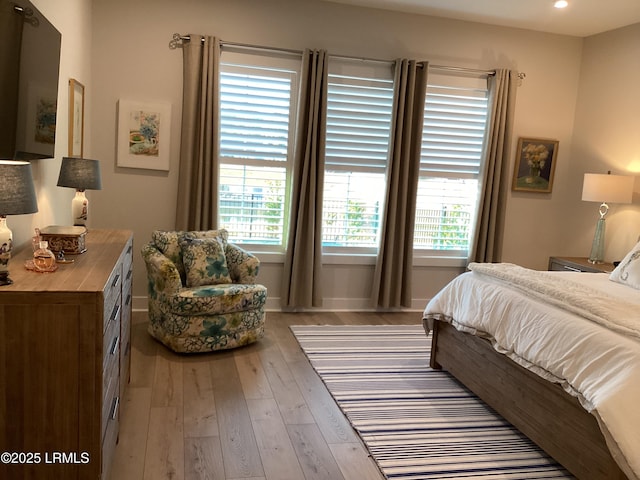 bedroom featuring light wood-type flooring