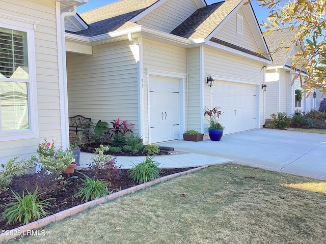 doorway to property with a garage