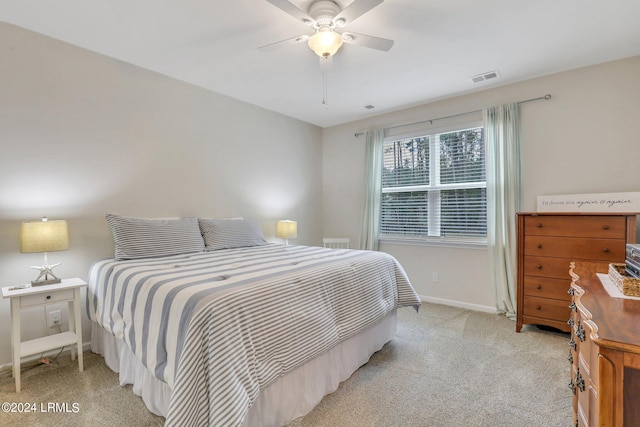 bedroom with light colored carpet and ceiling fan