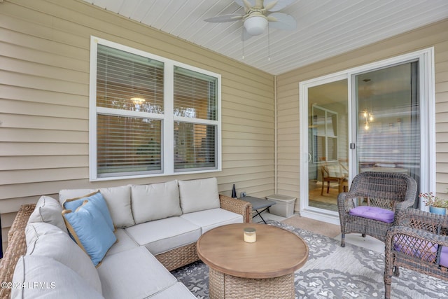 sunroom featuring ceiling fan